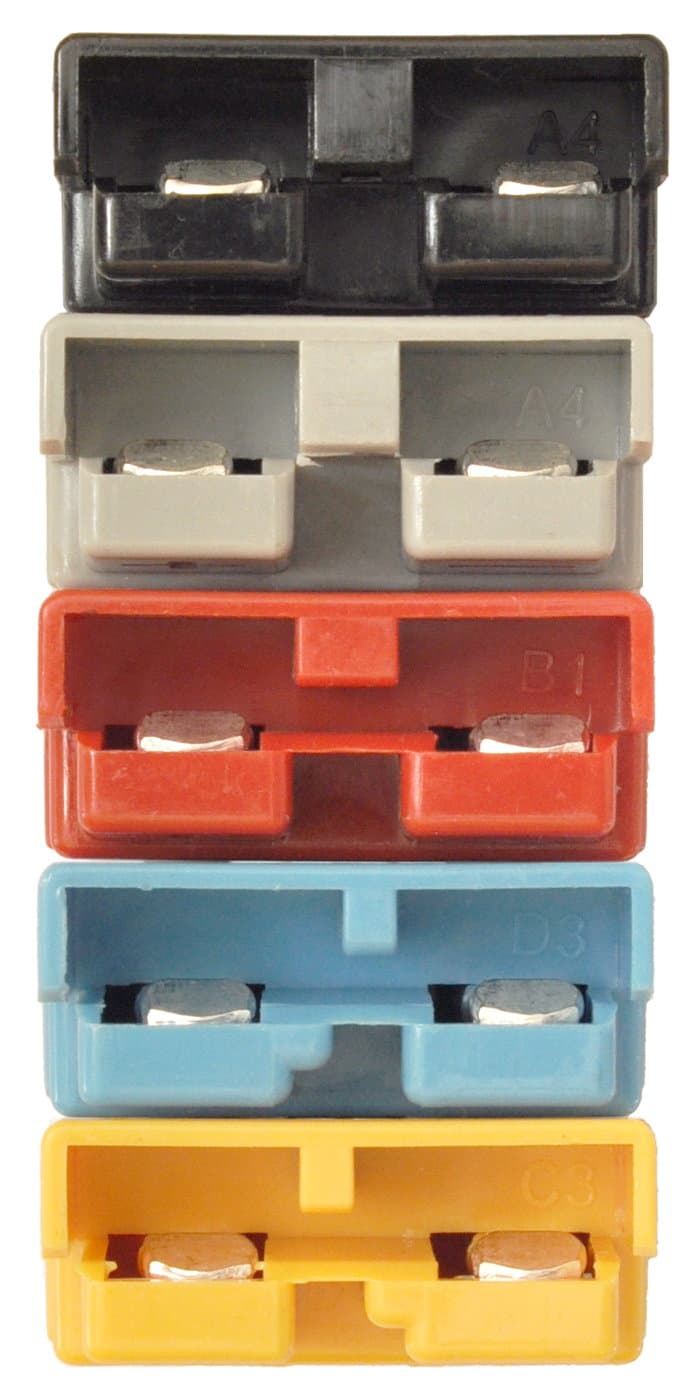 Anderson SB-series battery connectors in five voltage-keyed colors — black, grey, red, blue, and yellow — the industry-standard connectors used to connect forklift batteries to trucks.